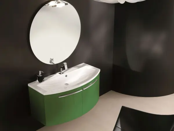Waschtisch OLA 12 mit konvex gewölbten Fronten in Grün und organisch geformtem weißen Becken