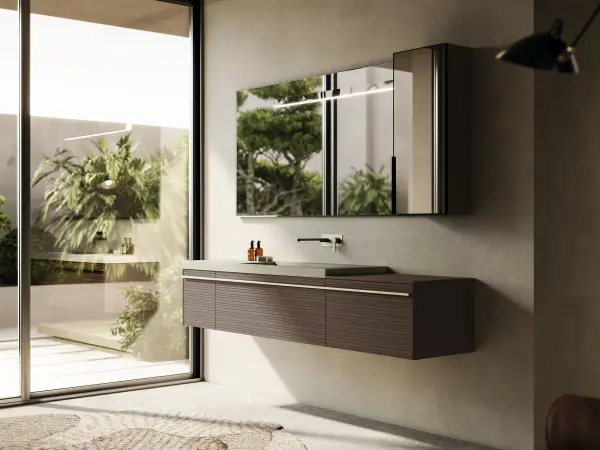 Waschtisch REVERSO 01 mit heller Gress-Steinplatte und gerillten Fronten in gedecktem Braun